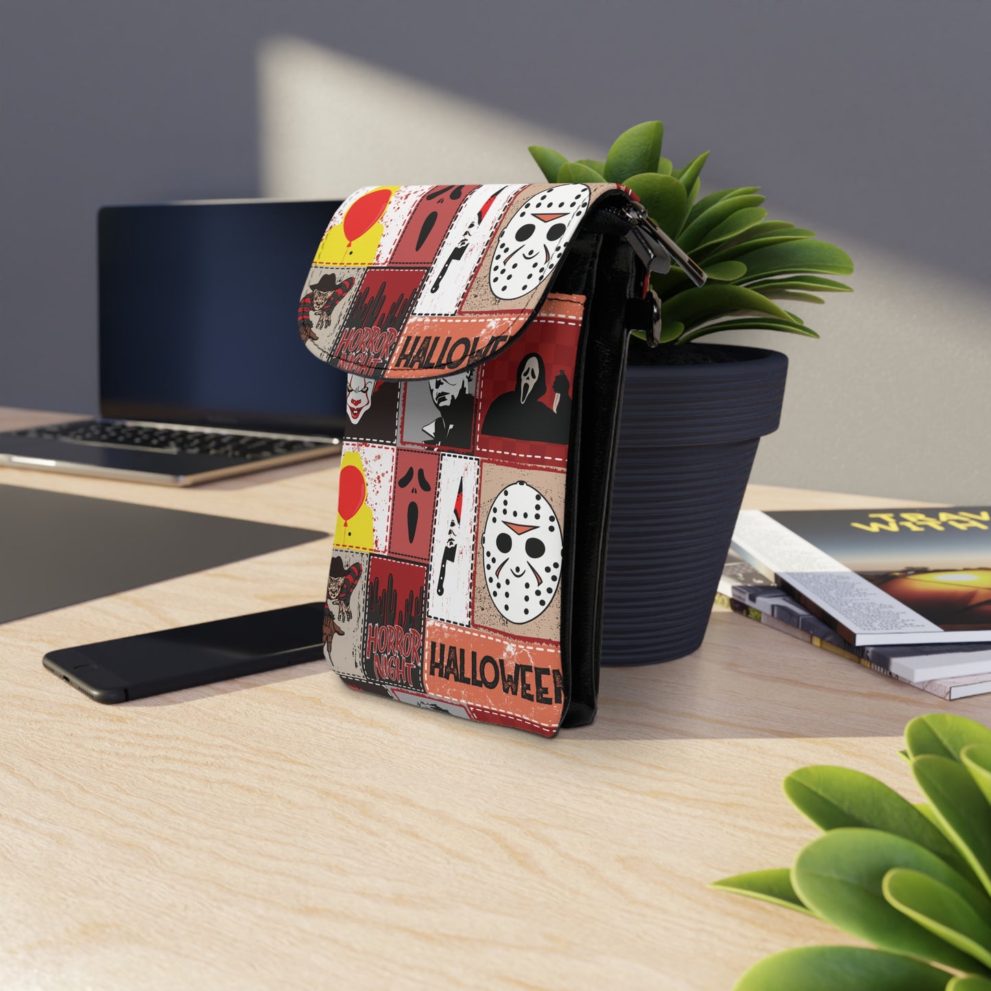 Halloween Horror Characters Cell Phone Wallet Bag with classic horror masks and themed illustrations on a desk setting