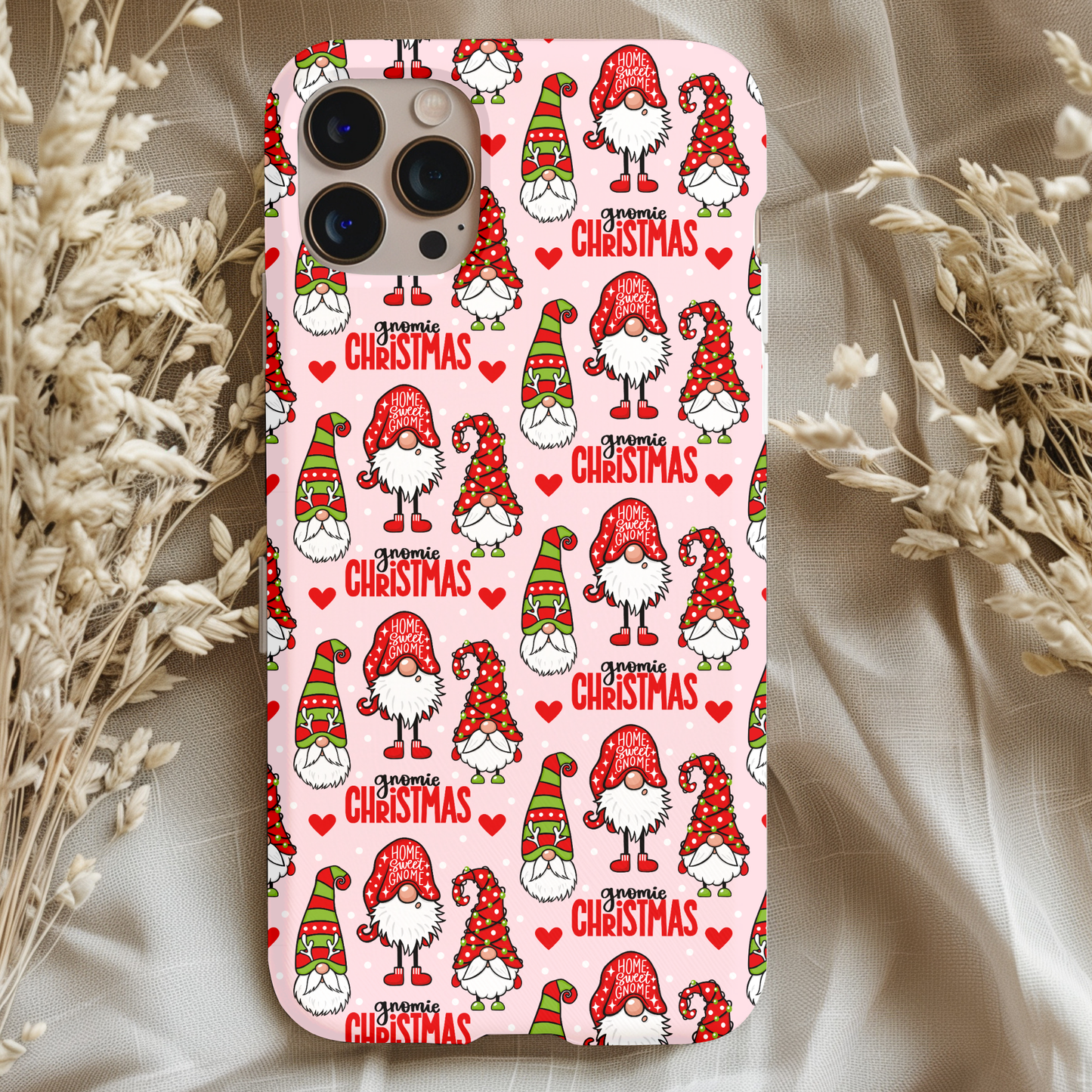 Gnomies Christmas Phone Case featuring cute gnome characters and holiday-themed design on a light background.