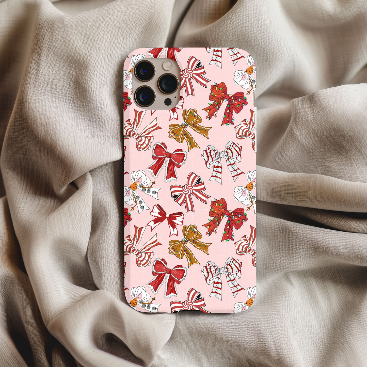 Coquette Christmas Bows Phone Case with red, white, and gold festive bow patterns on a soft pink background.