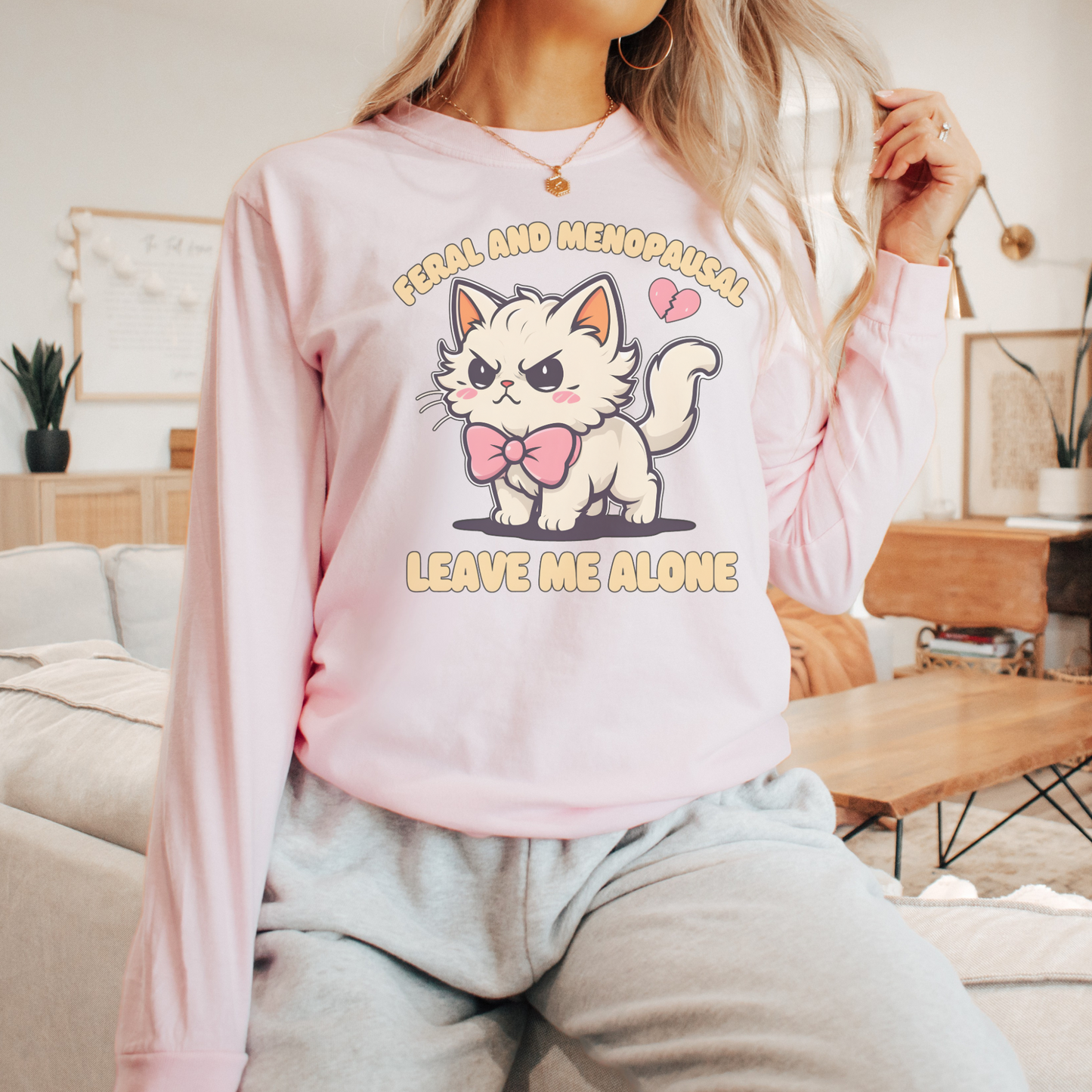 Woman wearing Cute Feral and Menopausal Cat Comfort Colors® Shirt Sweatshirt with a cute angry cat graphic and text design