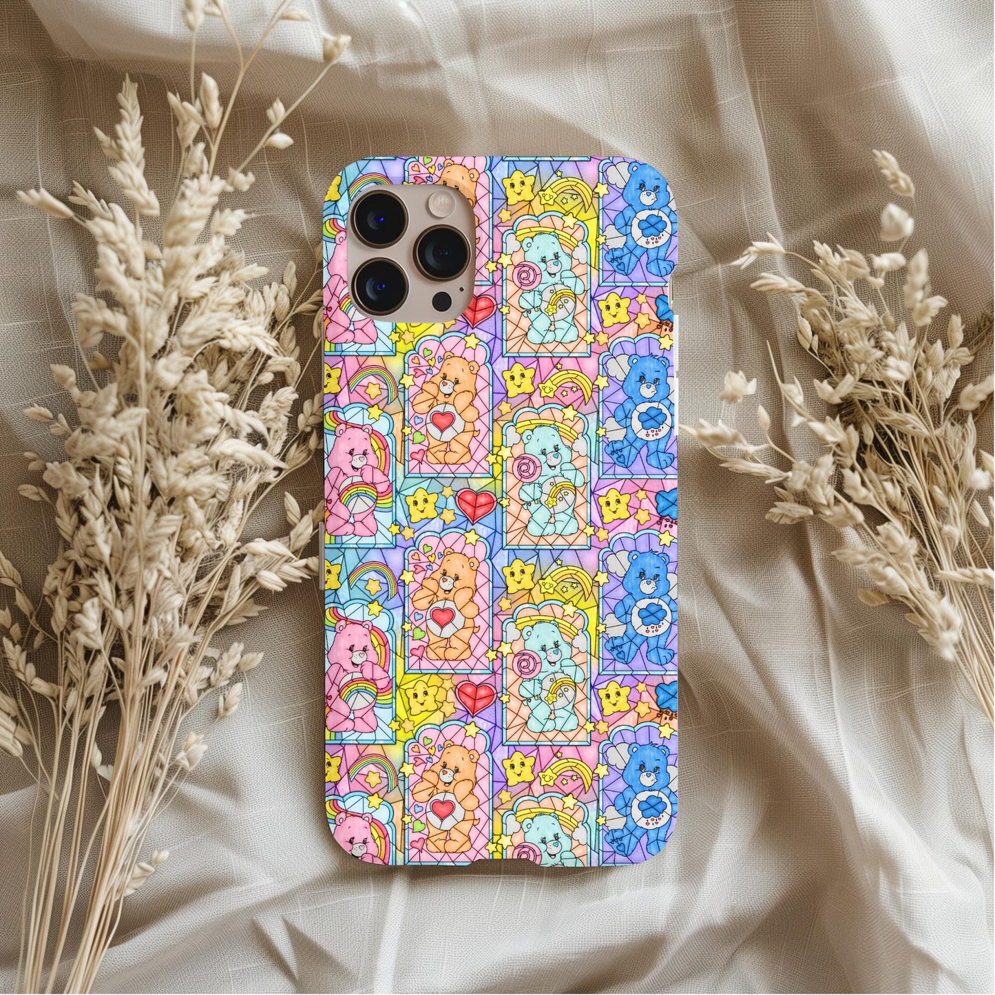 Nostalgic Care Bears Stained Glass Phone Case with colorful, charming Care Bears pattern on a soft fabric background