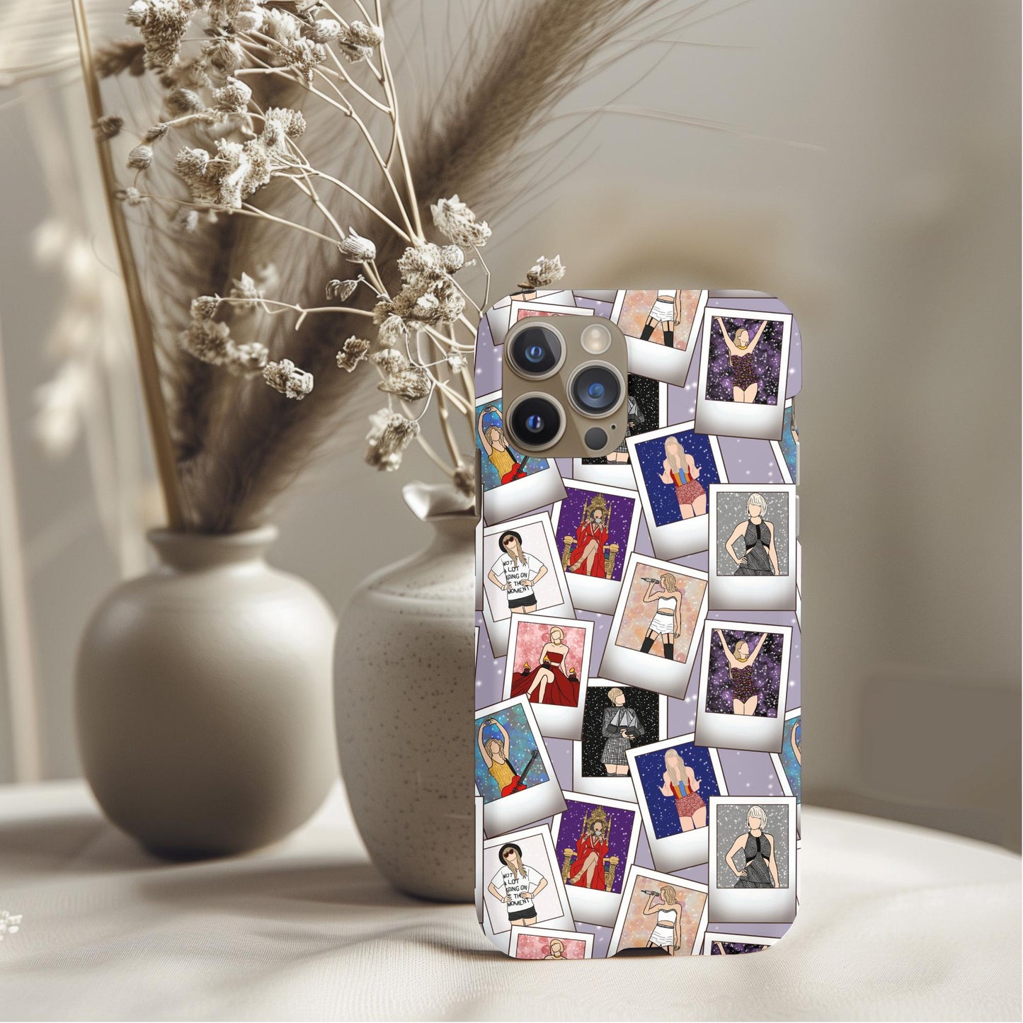 Taylor Swift Tarot Cards Phone Case with artistic polaroid-style images on a light purple background displayed on a phone