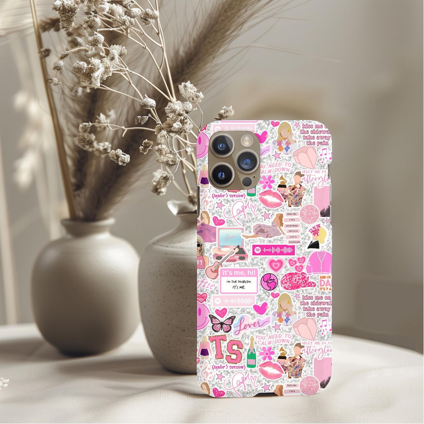 Taylor Swift Pink Icons Phone Case featuring colorful pink-themed stickers and iconic Taylor Swift symbols on a phone cover