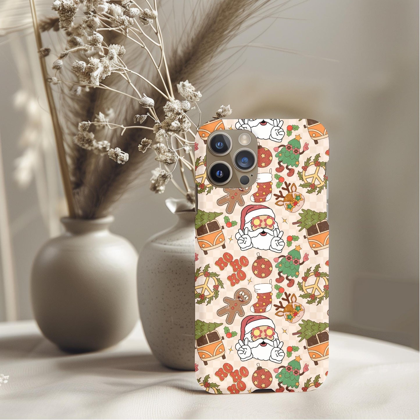 Groovy Christmas Phone Case featuring Santa, gingerbread, wreaths, and festive holiday icons in a warm color palette.