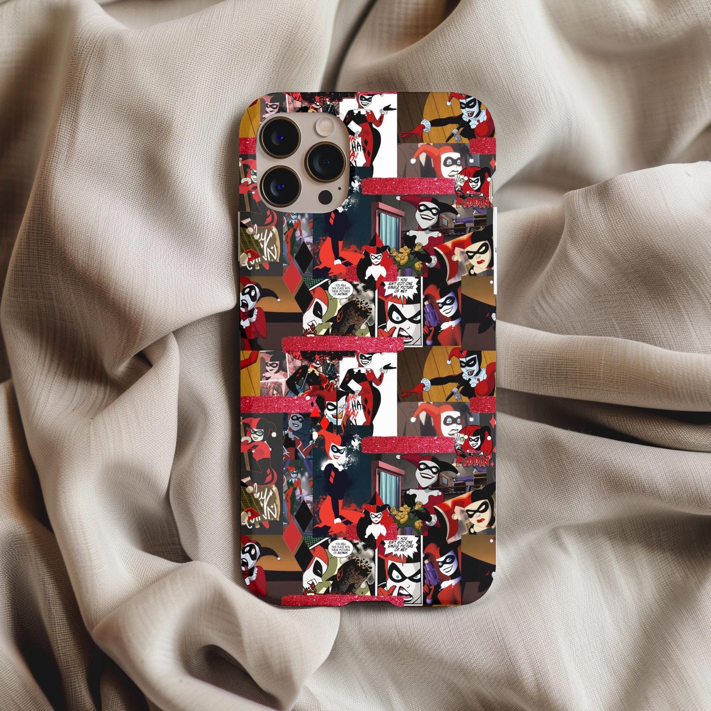 Harley Quinn Comic Phone Case featuring colorful comic strip design on a smartphone, laid on soft fabric background