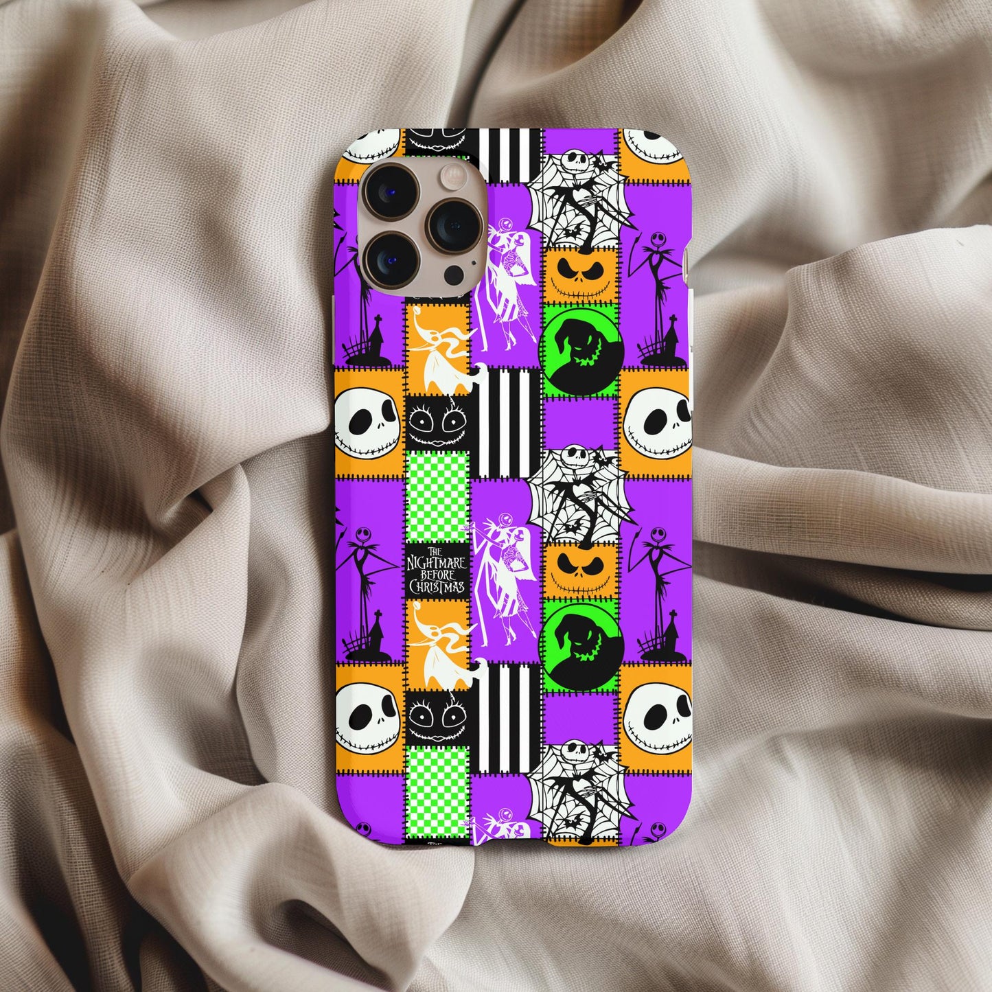 Nightmare Before Christmas Patchwork Phone Case featuring colorful character blocks and spooky Halloween designs on a phone.