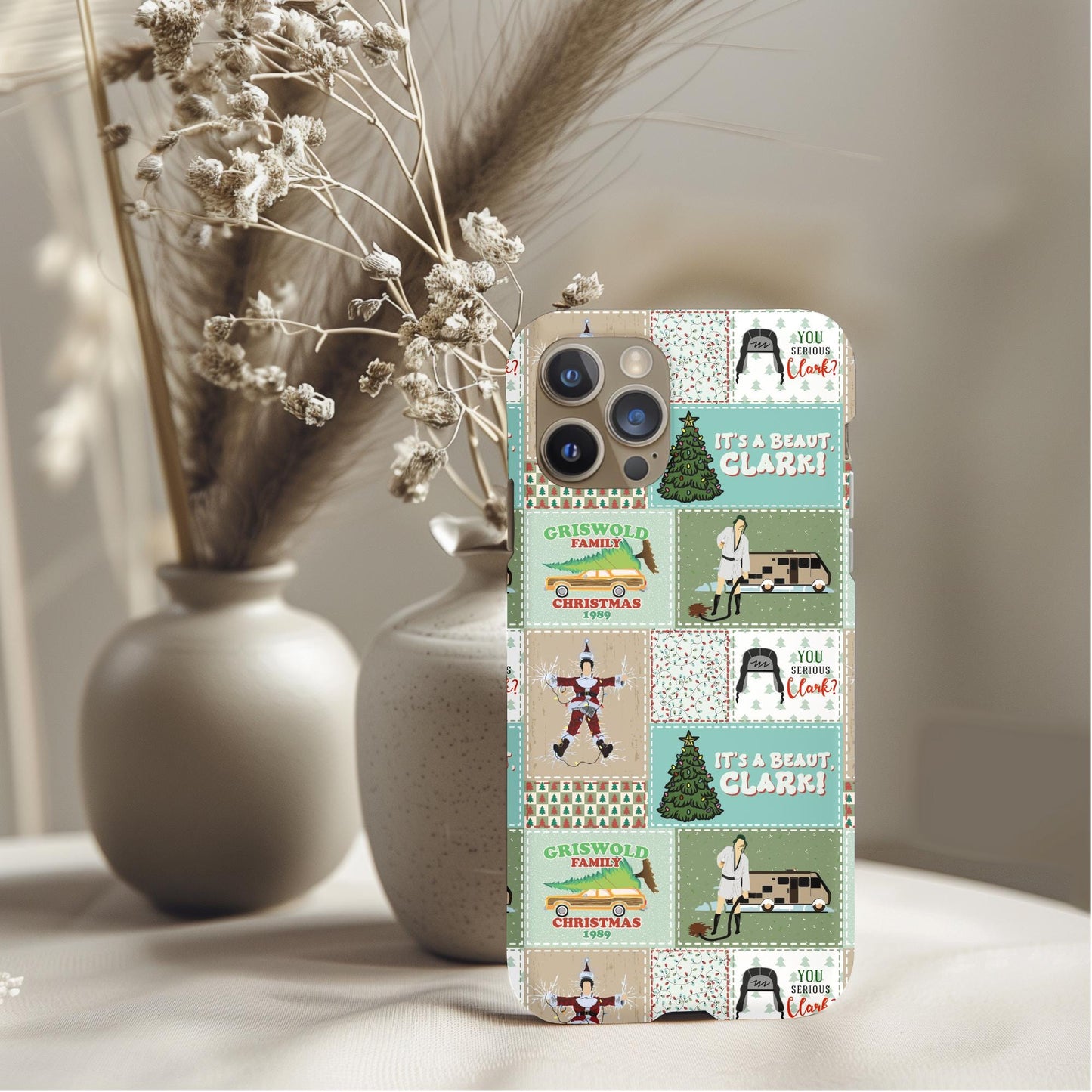 Christmas Vacation Phone Case featuring vintage holiday scenes and quotes inspired by the classic movie design