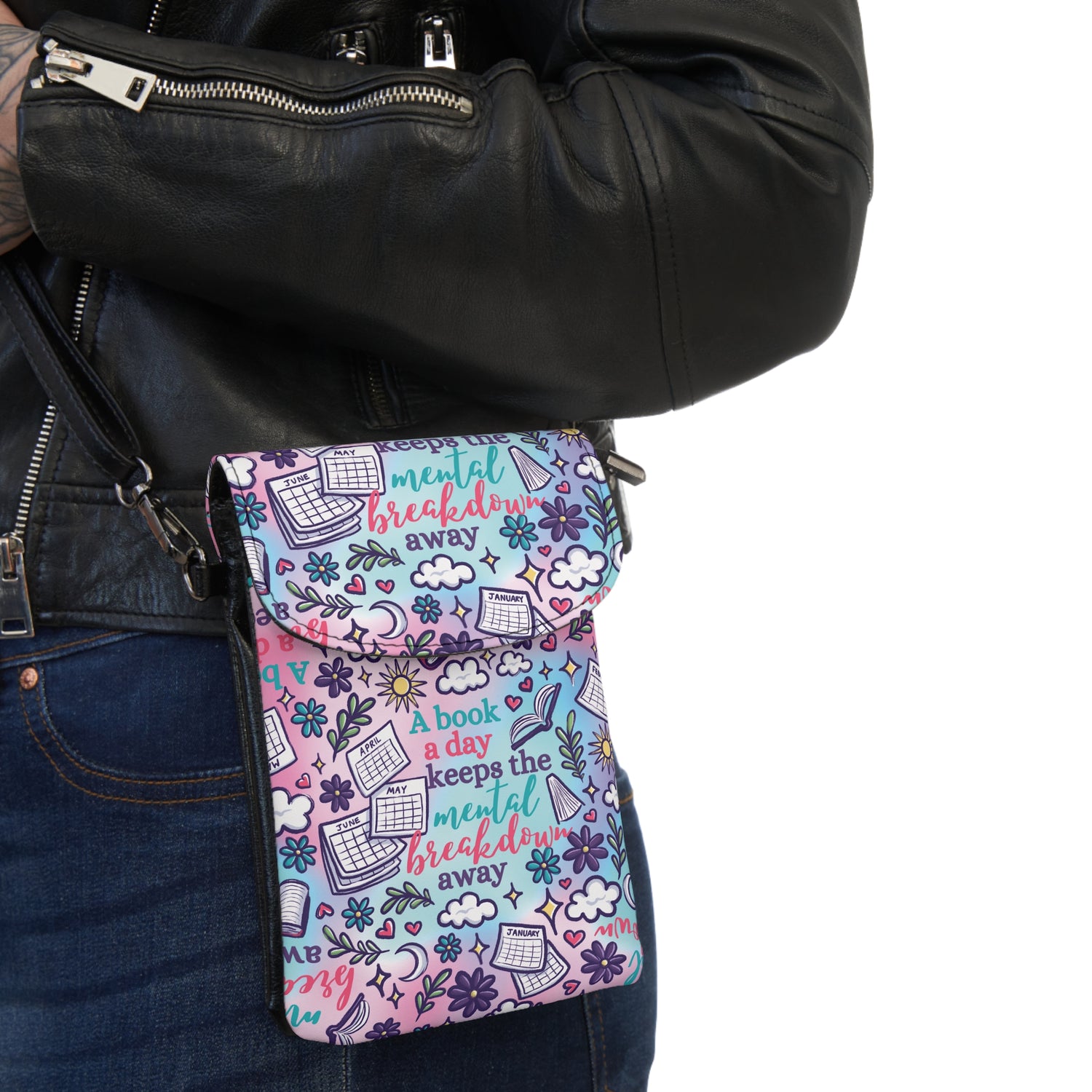 Woman wearing a leather jacket carrying A Book A Day Keeps The Mental Breakdown Away Cell Phone Wallet Bag with colorful print