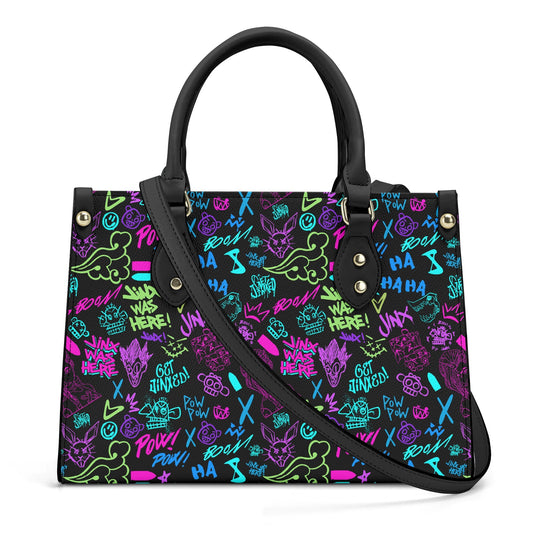 Arcane Jinx Graffiti Leather Handbag with colorful street art-inspired designs and black handles and strap