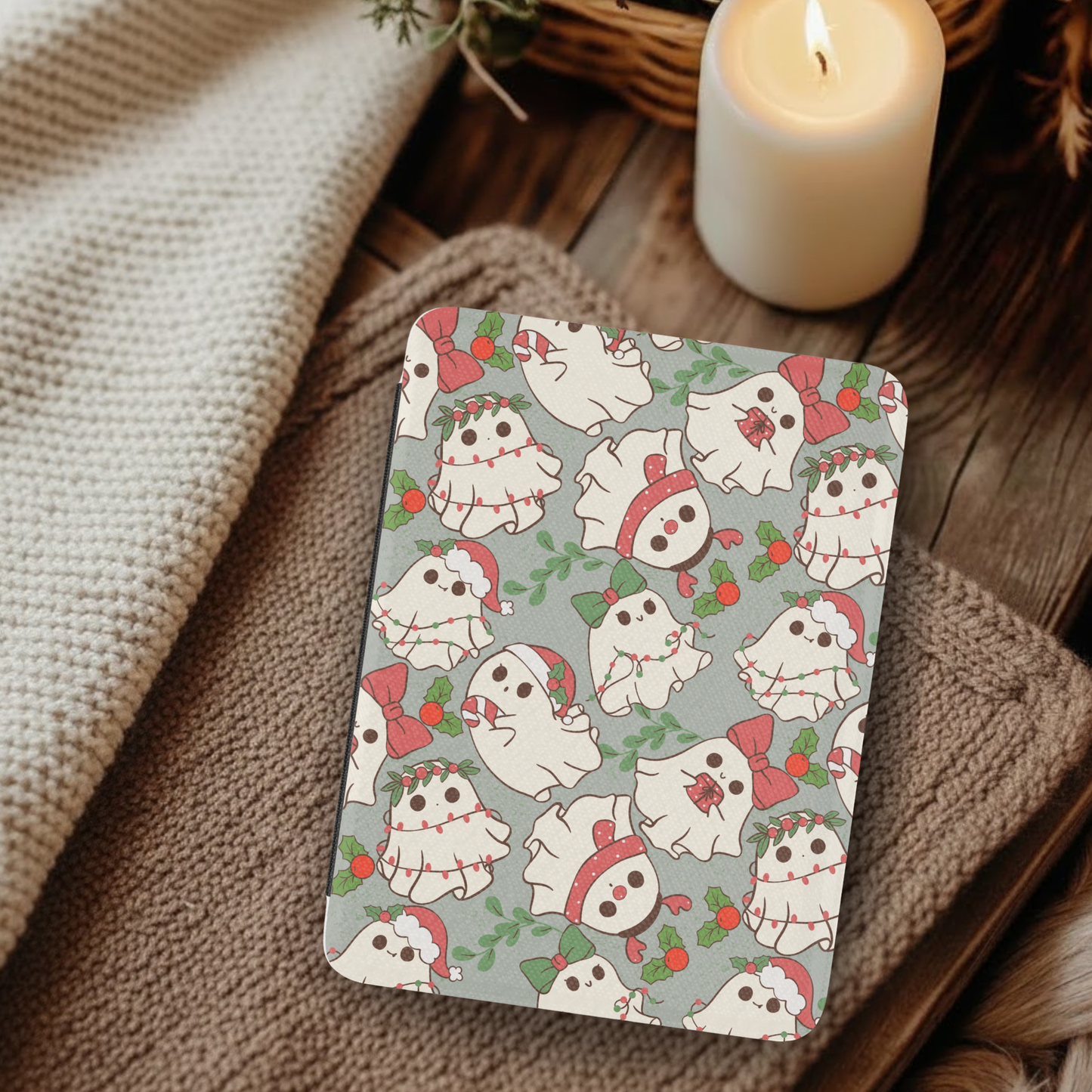 Christmas Ghosties Leather Kindle Case with Hand Strap featuring festive ghost patterns on a cozy rustic background