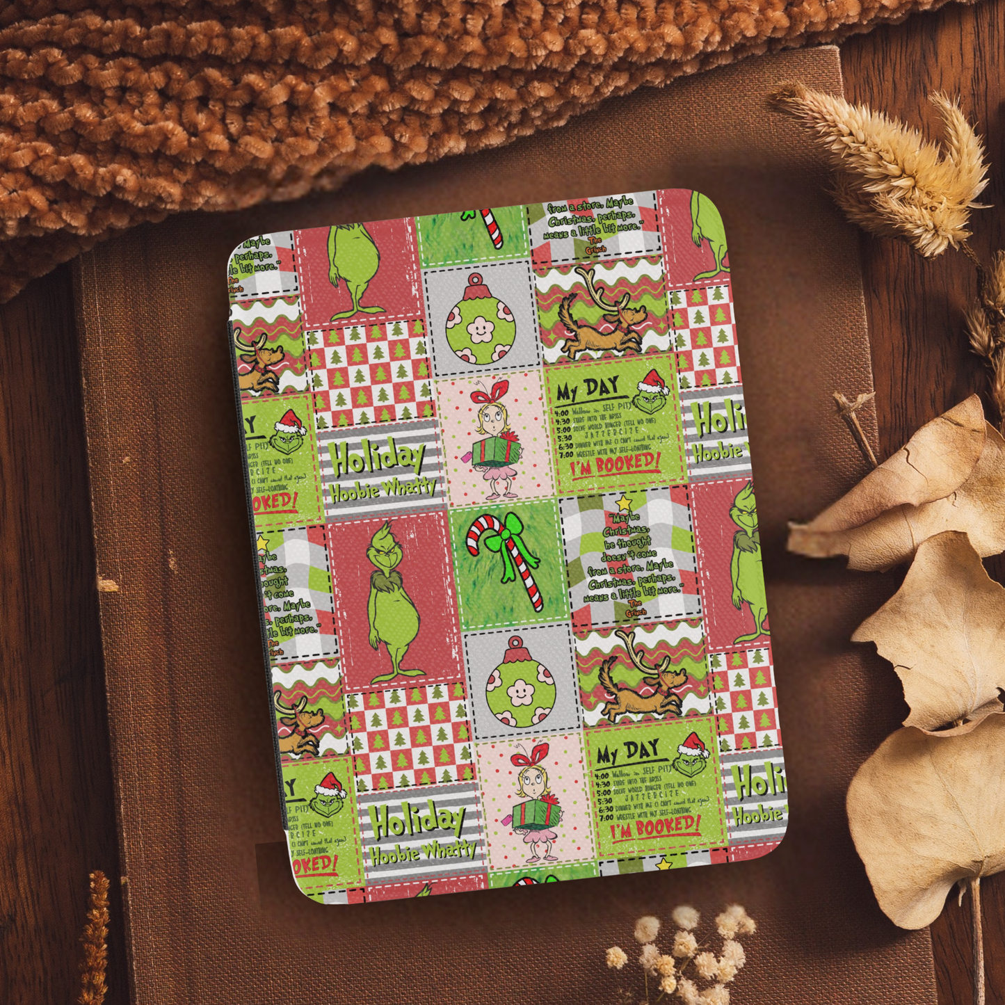 Christmas Grinch Patchwork Leather Kindle Case with Hand Strap featuring festive holiday-themed colorful cartoon designs on a rustic background