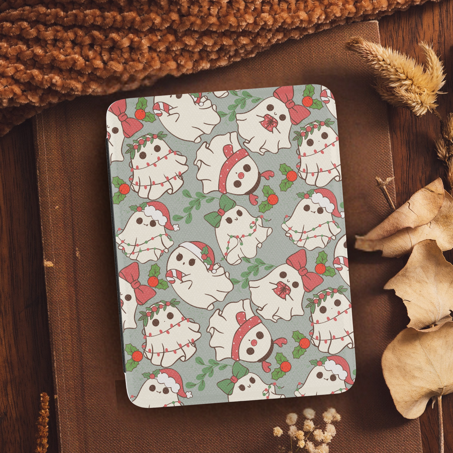 Christmas Ghosties Leather Kindle Case with Hand Strap featuring cute festive ghost illustrations on neutral background
