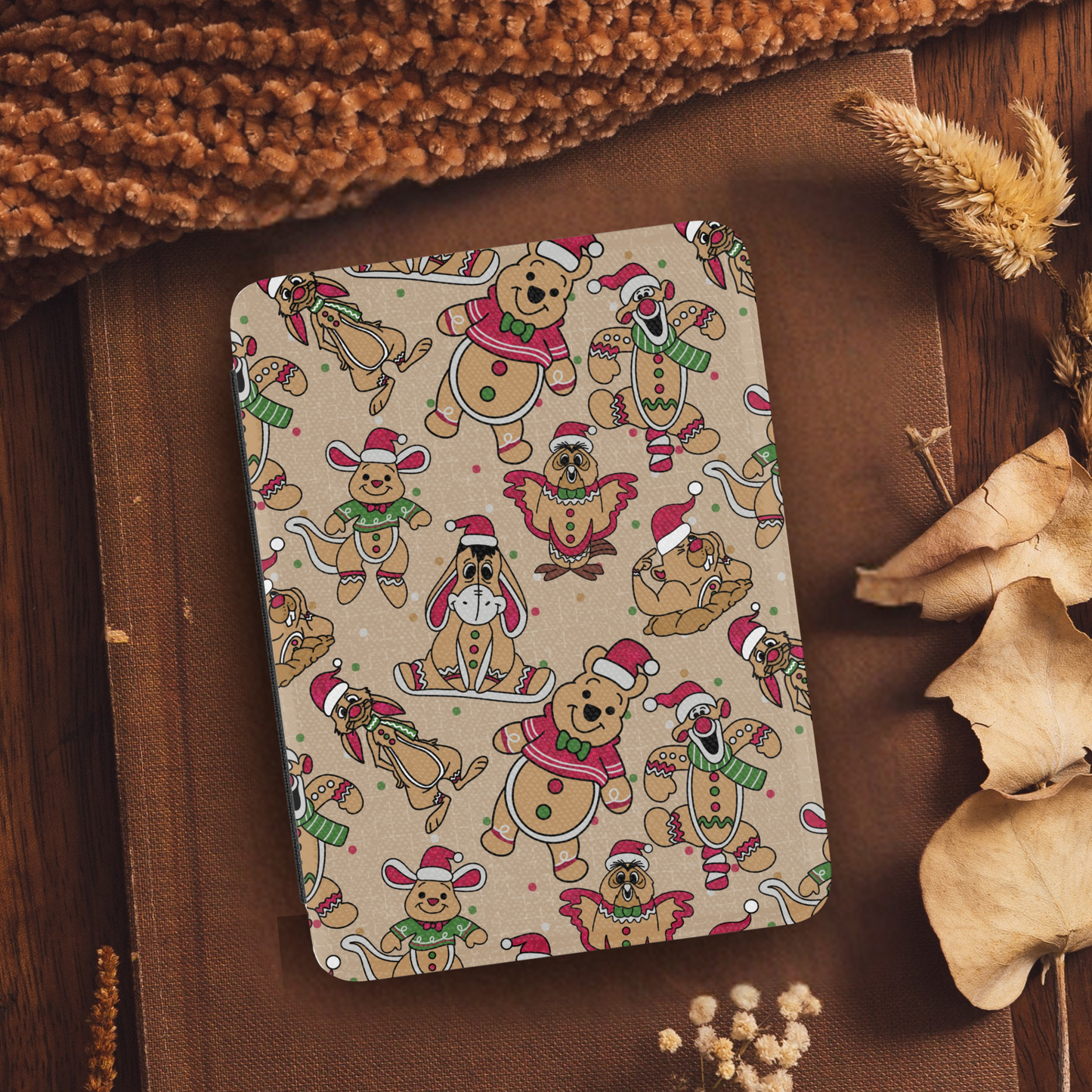 Christmas Winnie the Pooh Bear Leather Kindle Case with Hand Strap featuring festive character pattern on a cozy autumn background