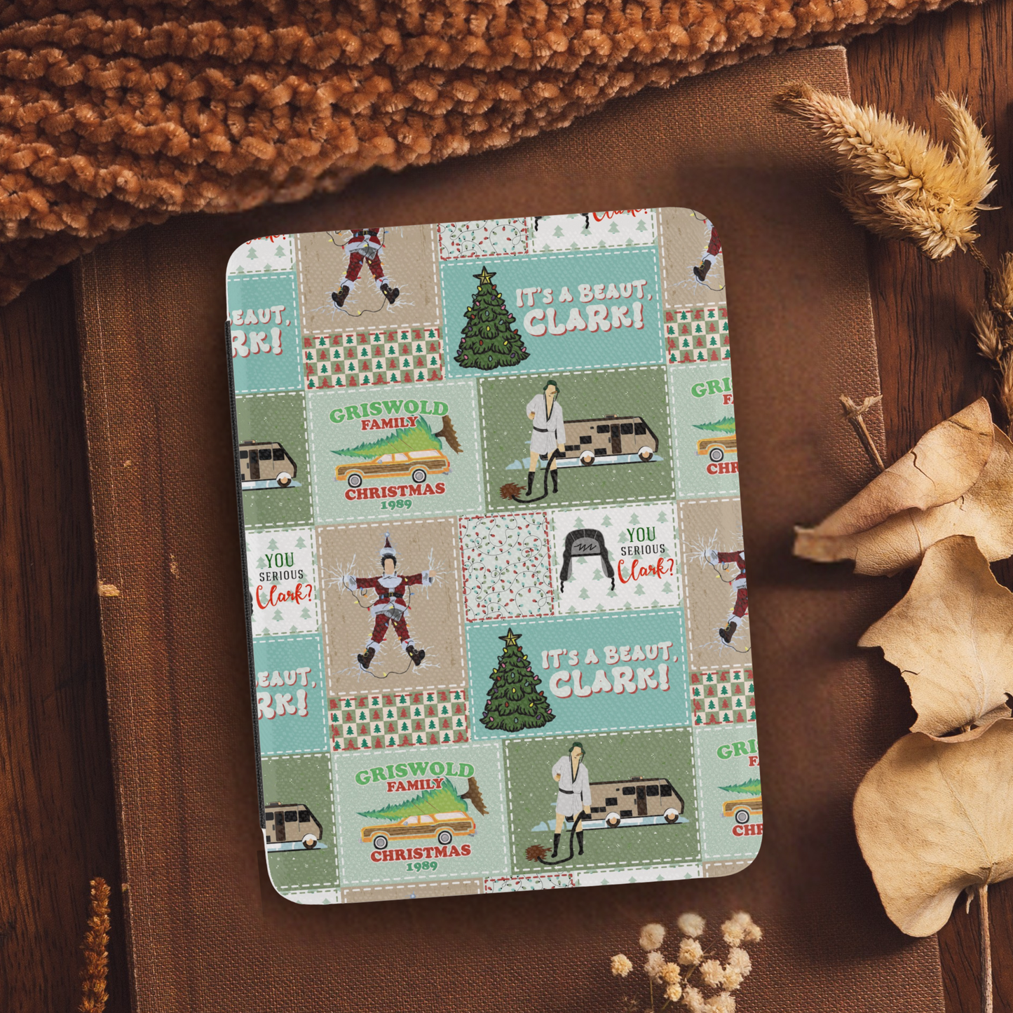 Christmas Vacation Patchwork Leather Kindle Case with Hand Strap featuring festive holiday-themed patchwork design on a cozy background