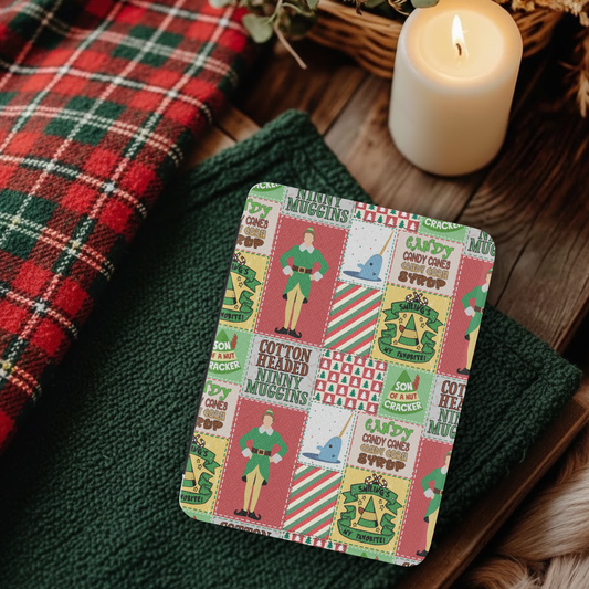 Christmas Elf Patchwork Leather Kindle Case with Hand Strap on cozy fabric near candle and plaid cloth background